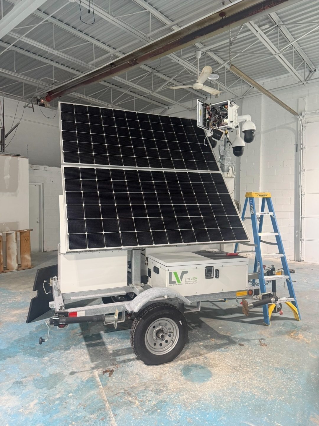 ClearCam solar-powered mobile surveillance trailer with solar panels, camera mast, and PTZ cameras